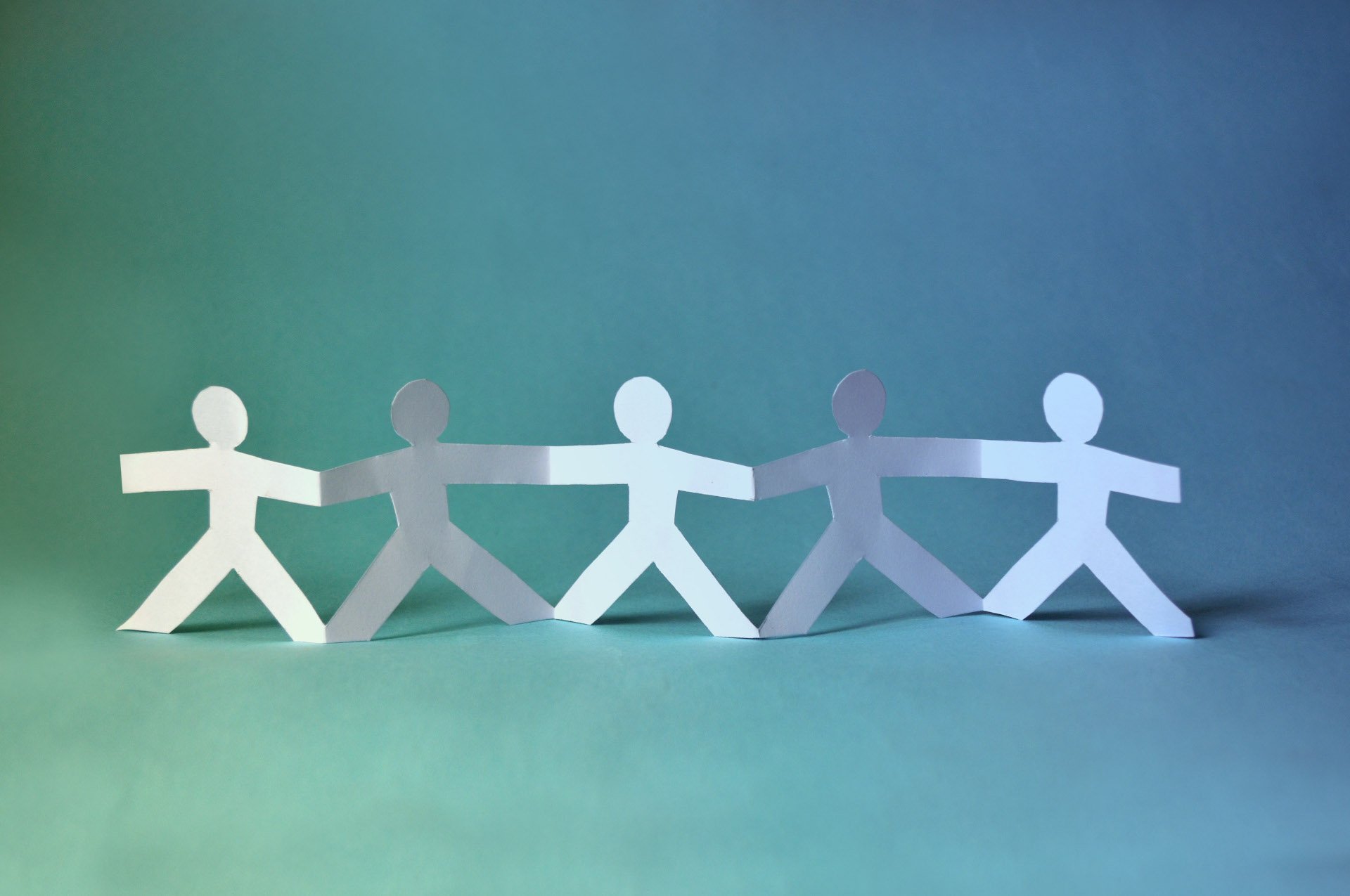 A group of paper people.